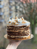 Gluten-free Argentine rogel cake with thin crisp pastry layers, dulce de leche filling, and Italian meringue topping, handmade by Gluten Tag in Copenhagen.